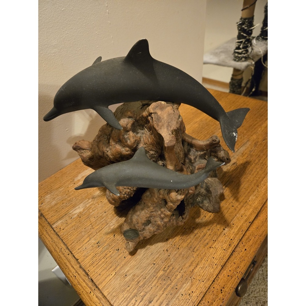 John Perry dolphin figurine